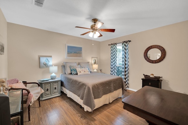 bedroom featuring ceiling fan and hardwood / wood-style floors