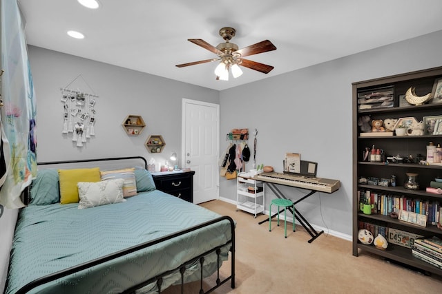 bedroom with light carpet and ceiling fan