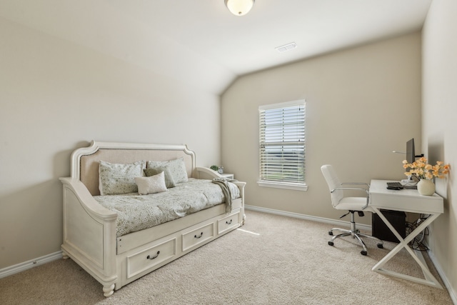 carpeted bedroom featuring lofted ceiling