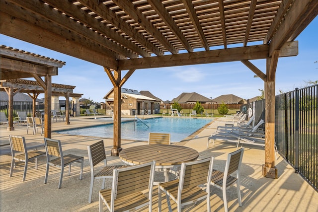 view of swimming pool with a patio area and a pergola