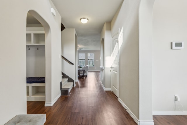 hallway with dark hardwood / wood-style floors