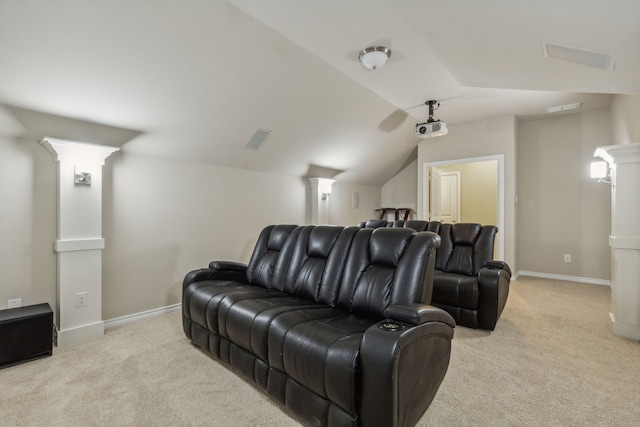 carpeted cinema featuring lofted ceiling