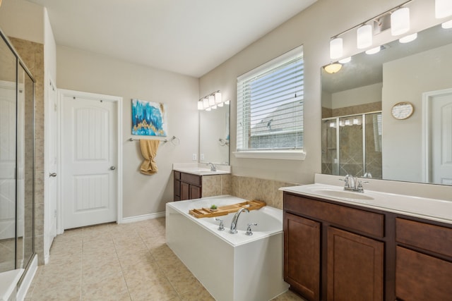 bathroom with vanity, tile patterned floors, and plus walk in shower