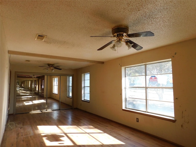 420 Lawson Ln, Pilot Point, TX 76258 - empty room featuring a textured ceiling, a ceiling fan, and wood finished floors