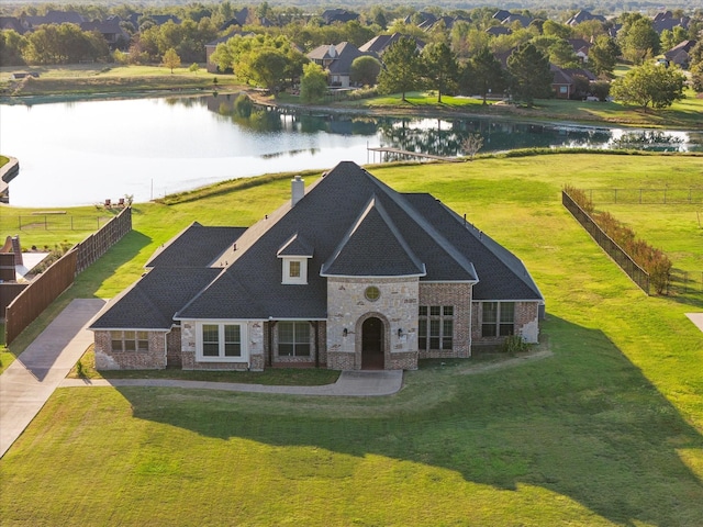 10270 County Road 213, Talty, TX 75126 - view of front facade with a water view, brick siding, a chimney, and stone siding