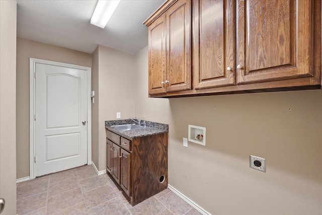 10270 County Road 213, Talty, TX 75126 - laundry room featuring electric dryer hookup, cabinet space, hookup for a washing machine, and light tile patterned floors
