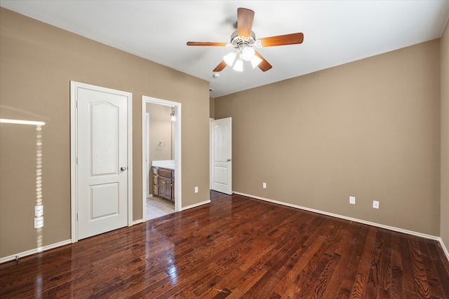 unfurnished bedroom featuring ceiling fan, wood-type flooring, and ensuite bathroom