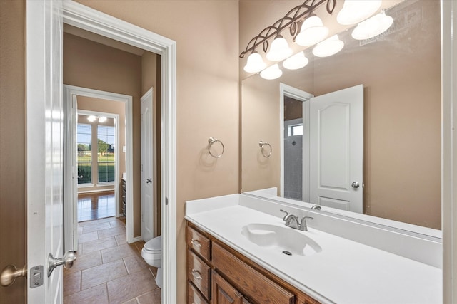 bathroom with vanity and toilet