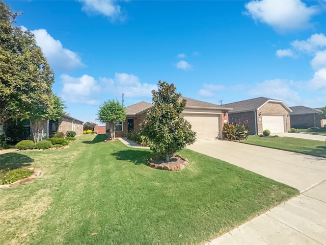 view of front of house with a garage and a front lawn