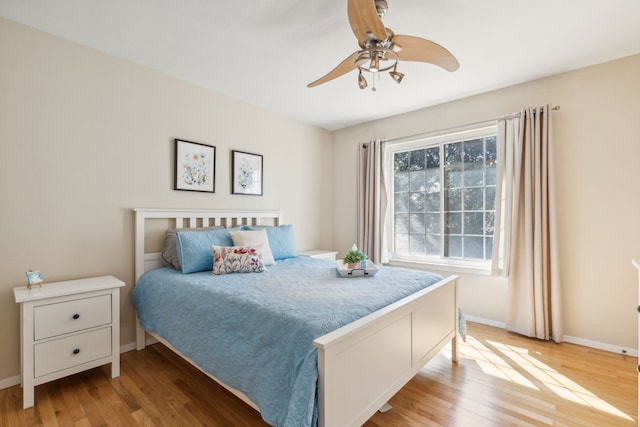 bedroom featuring light hardwood / wood-style floors and ceiling fan