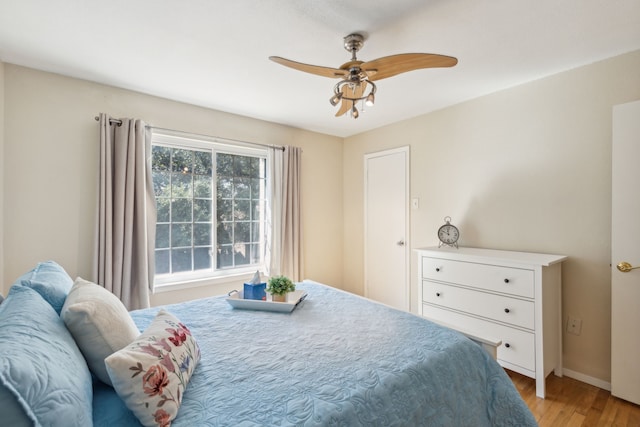 bedroom featuring ceiling fan and light hardwood / wood-style floors