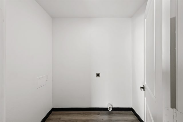 washroom with hookup for an electric dryer and dark hardwood / wood-style flooring