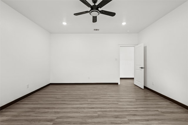 unfurnished room featuring ceiling fan and wood-type flooring