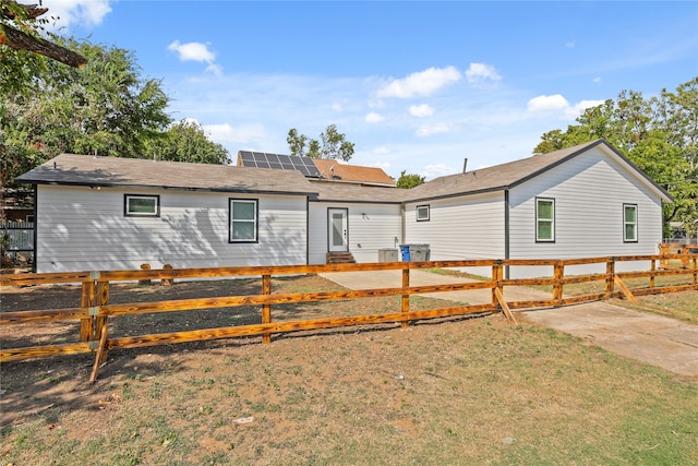 back of house featuring a yard and a patio area