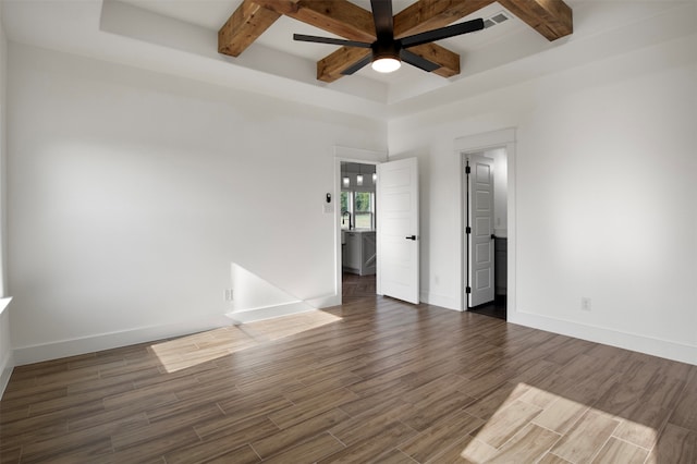 spare room with dark hardwood / wood-style floors, beamed ceiling, and ceiling fan