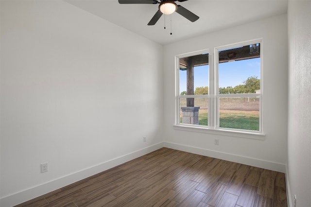 empty room with hardwood / wood-style flooring and ceiling fan