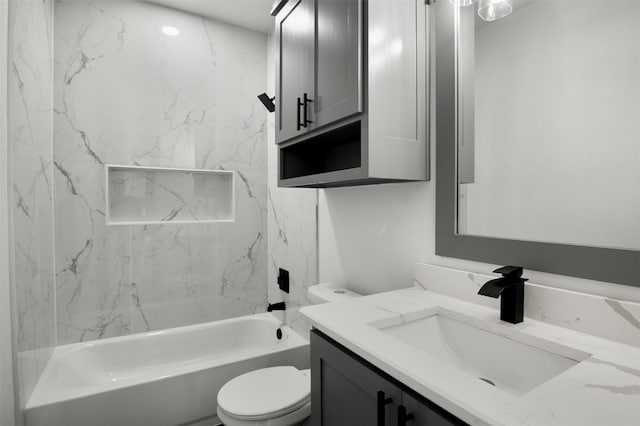 full bathroom featuring vanity, toilet, and tiled shower / bath