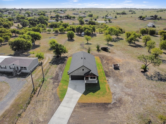 birds eye view of property featuring a rural view