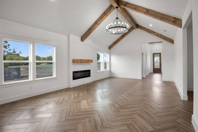 unfurnished living room featuring vaulted ceiling with beams, a notable chandelier, parquet flooring, and a healthy amount of sunlight