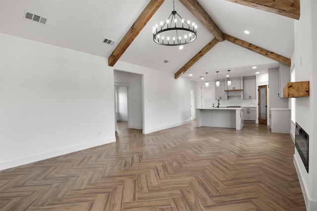 unfurnished living room with vaulted ceiling with beams, dark parquet flooring, and an inviting chandelier