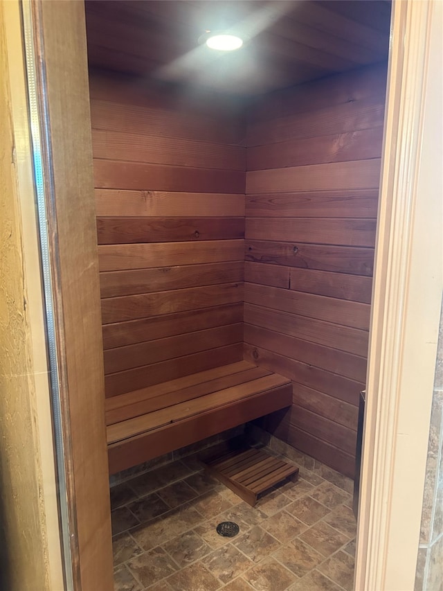 view of sauna featuring wood walls