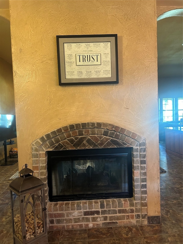 details with a fireplace and tile patterned floors