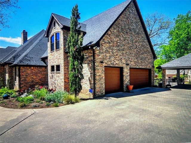 view of side of property with a garage