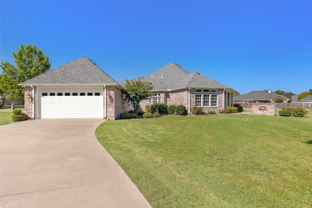 view of front facade with a garage and a front yard