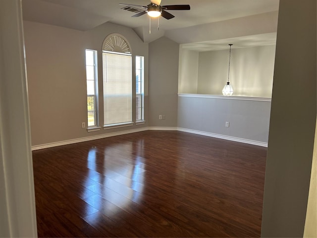 spare room featuring lofted ceiling, ceiling fan, and dark hardwood / wood-style floors