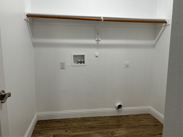 washroom featuring hookup for an electric dryer, hookup for a gas dryer, dark hardwood / wood-style floors, and hookup for a washing machine