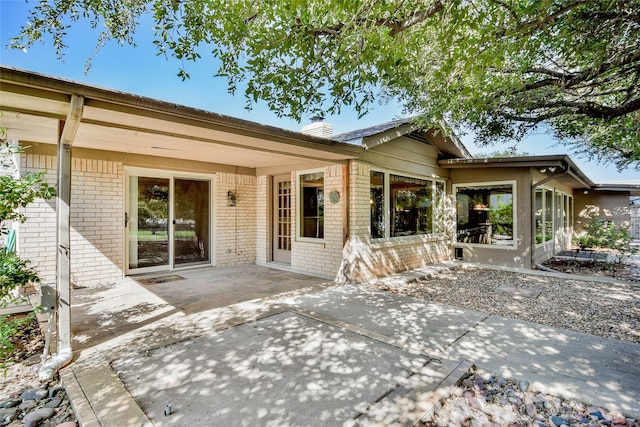 back of property with a patio area