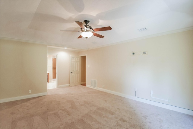 carpeted empty room with crown molding and ceiling fan