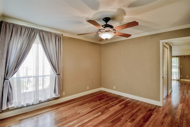 unfurnished room featuring ceiling fan, ornamental molding, and light hardwood / wood-style flooring