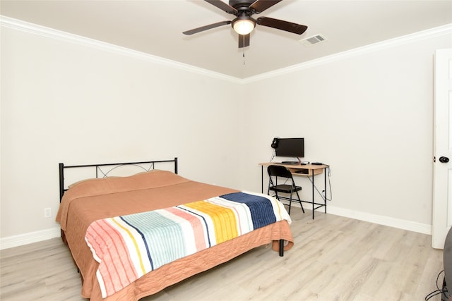 bedroom featuring ornamental molding, light wood-type flooring, and ceiling fan