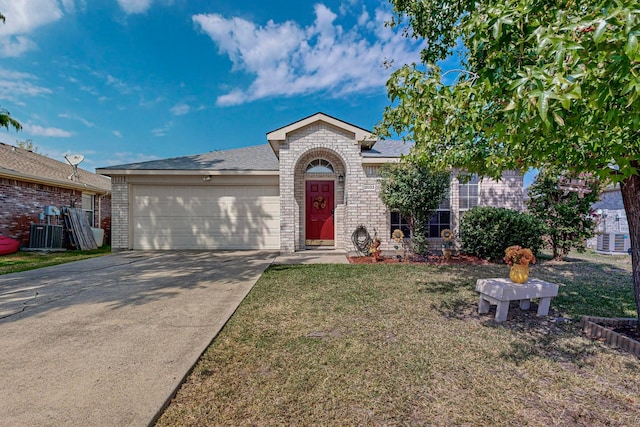 ranch-style home with a front yard and a garage