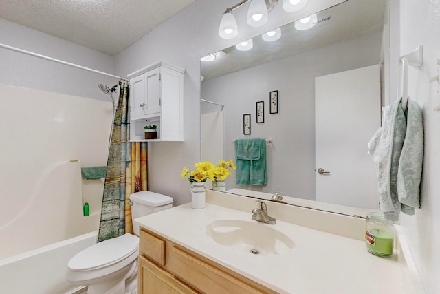 full bathroom featuring vanity, a textured ceiling, hardwood / wood-style flooring, shower / bathtub combination with curtain, and toilet