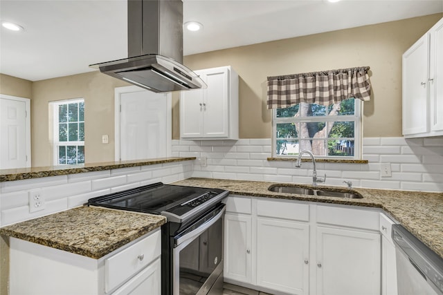 kitchen featuring white cabinets, sink, dark stone counters, appliances with stainless steel finishes, and island exhaust hood