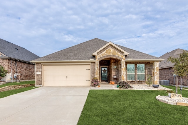 single story home featuring a front yard and a garage