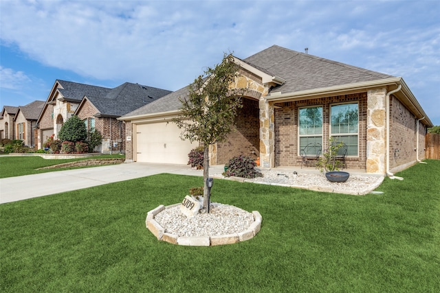 view of front of house featuring a front yard and a garage