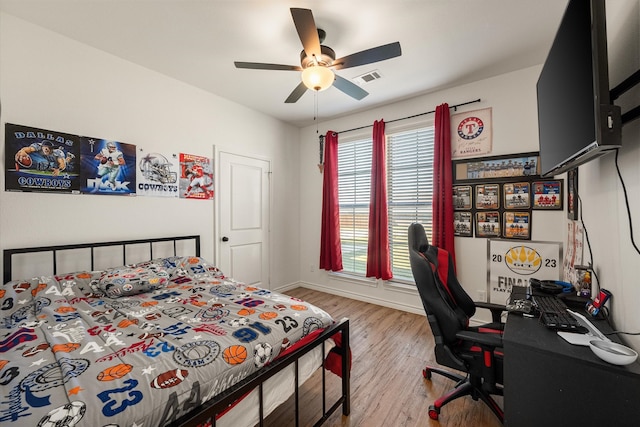 bedroom featuring ceiling fan and light hardwood / wood-style flooring