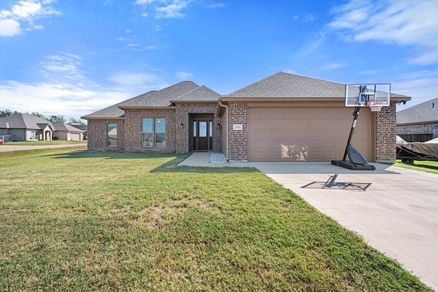 view of front facade featuring a front yard and a garage