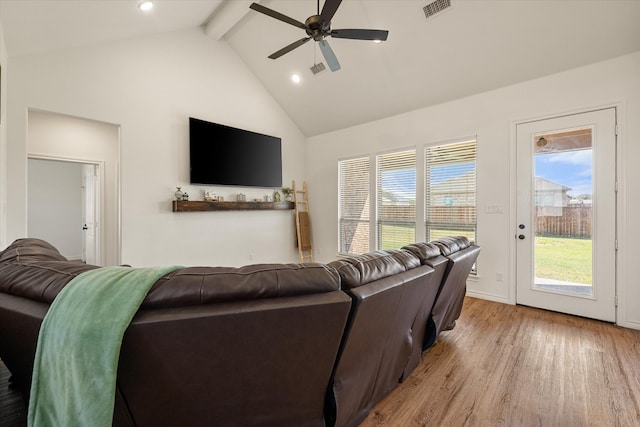 living room with beam ceiling, ceiling fan, high vaulted ceiling, and light wood-type flooring