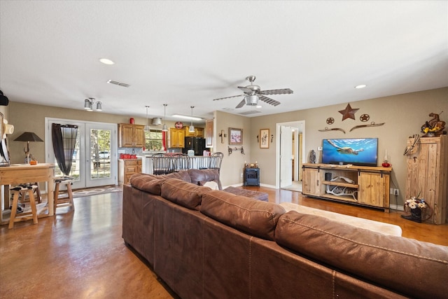 1455 County Road 2008 Unit B, Glen Rose, TX 76043 - living room with recessed lighting, finished concrete floors, a ceiling fan, and french doors