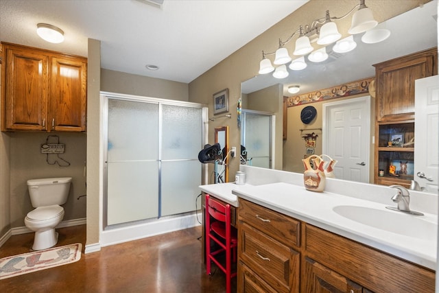 1455 County Road 2008 Unit B, Glen Rose, TX 76043 - bathroom featuring vanity, toilet, a shower stall, concrete flooring, and baseboards