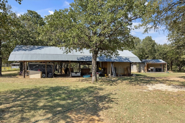 1455 County Road 2008 Unit B, Glen Rose, TX 76043 - rear view of property with a yard and a detached carport