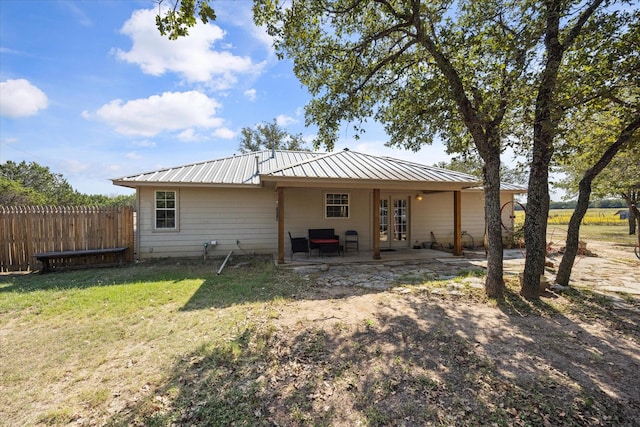 1455 County Road 2008 Unit B, Glen Rose, TX 76043 - rear view of house with french doors, metal roof, and a patio area