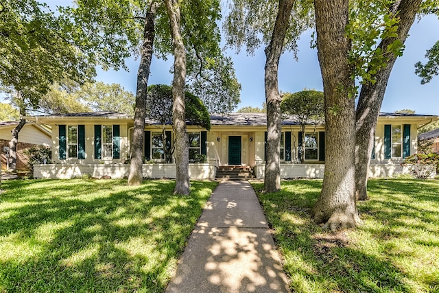 ranch-style house with a front lawn