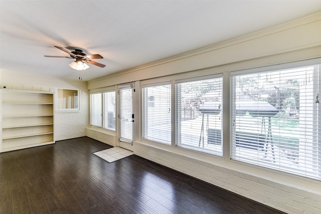 doorway to outside featuring dark wood finished floors and ceiling fan