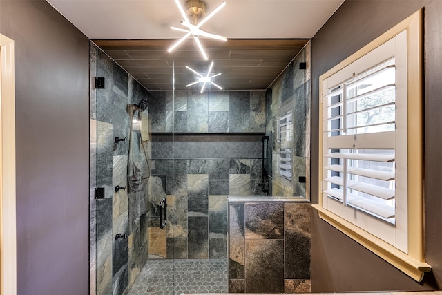 bathroom with tiled shower