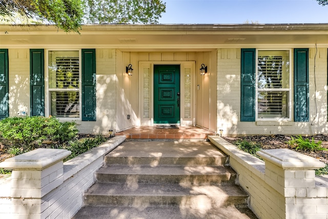 entrance to property with brick siding